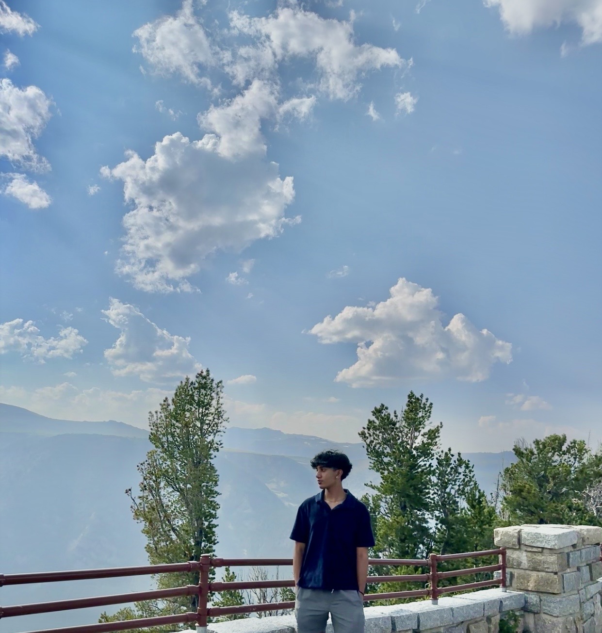 Hrishi Sunder standing at a mountain overlook